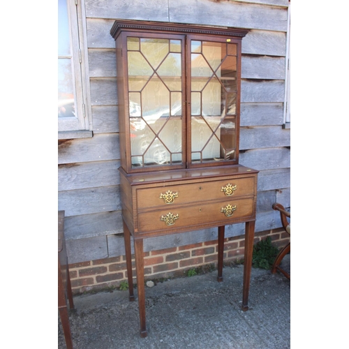 573 - A late Georgian mahogany secretaire bookcase, the upper section enclosed lattice glazed door over fi... 