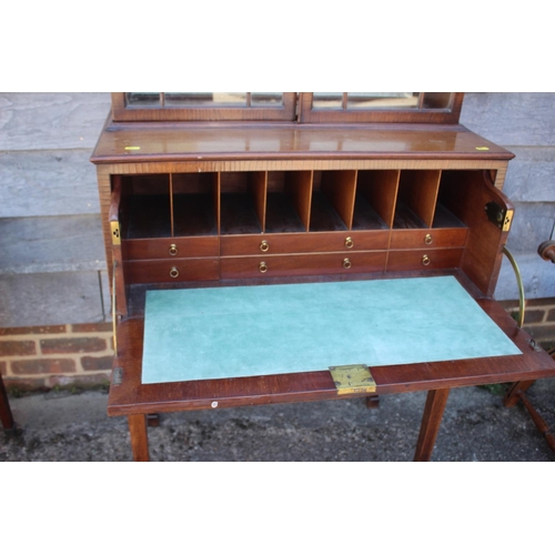 573 - A late Georgian mahogany secretaire bookcase, the upper section enclosed lattice glazed door over fi... 