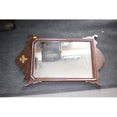 608 - A Georgian mahogany shaped frame wall mirror with fleur-de-lys finial, 17 1/4