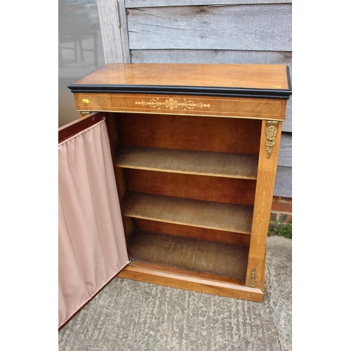 542 - A late 19th century walnut inlaid and brass bound pier cabinet enclosed single glazed door, on block... 