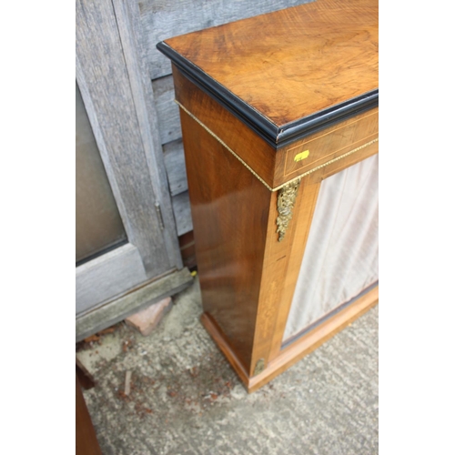 542 - A late 19th century walnut inlaid and brass bound pier cabinet enclosed single glazed door, on block... 