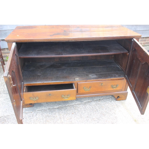 543 - An 18th century oak mule chest, now converted as a cupboard, fitted two drawers, on bracket feet, 55... 