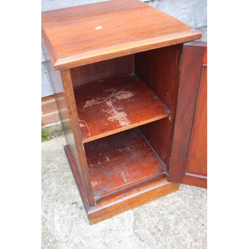 545 - A 19th century rosewood and inlaid bedside cupboard enclosed panel door, on block base, 16 1/2