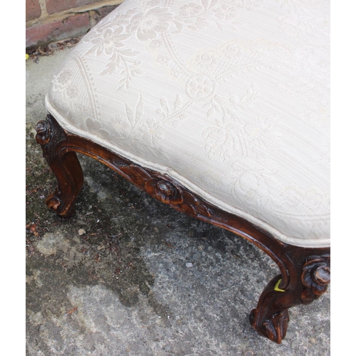 551 - A Victorian carved walnut frame stool, on cabriole castored supports, 19