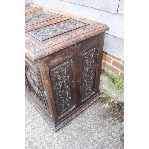 553 - A chip carved oak coffer of 16th century design with three Gothic panel front, on stile supports, 39... 