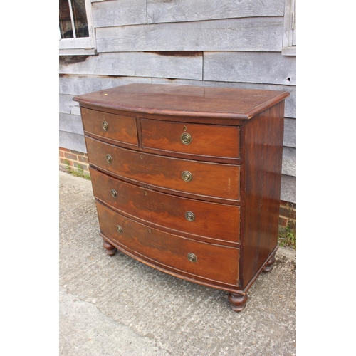 555 - A 19th century mahogany bowfront chest of two short and three long graduated drawers with brass ring... 