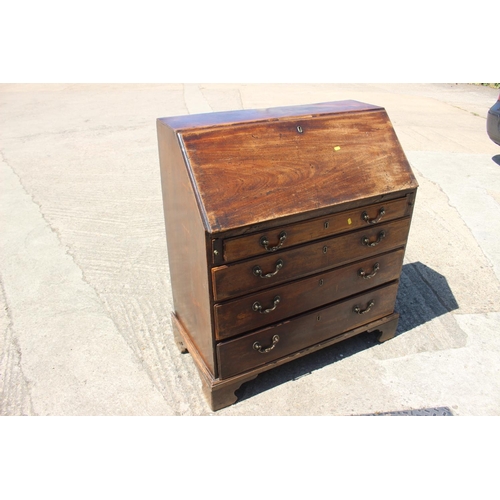 561 - A Georgian mahogany bureau with fitted interior over four long graduated drawers, on bracket support... 