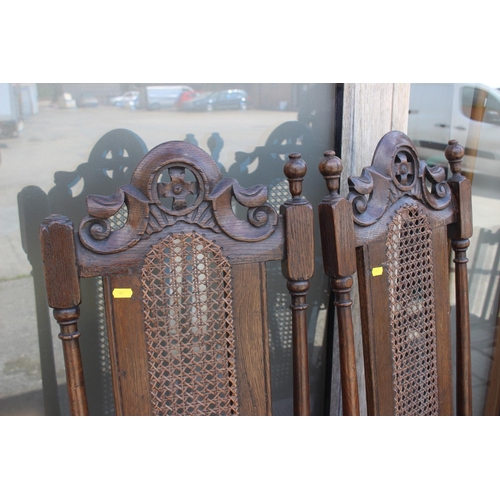 563 - A pair of 19th century carved oak high back chairs, in the manner of Daniell Marot, on shaped suppor... 