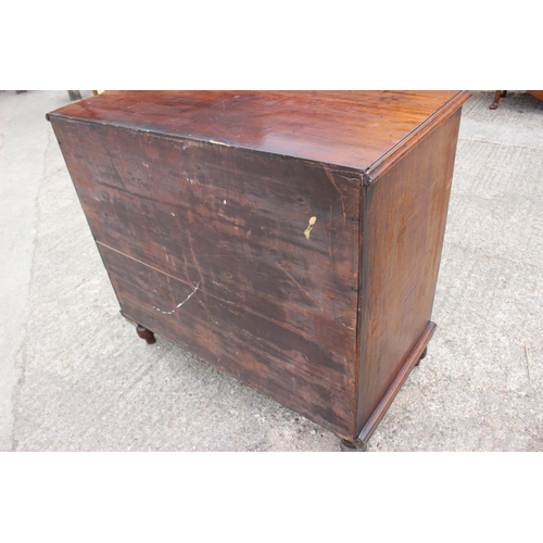 564 - A 19th century mahogany chest of four long graduated drawers with knob handles, on turned supports, ... 