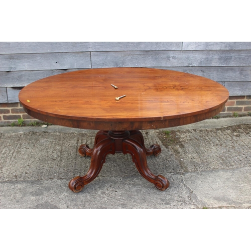 576 - A 19th century mahogany oval tilt top dining table, on turned column and tripod splay support, 60