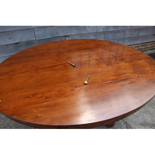 576 - A 19th century mahogany oval tilt top dining table, on turned column and tripod splay support, 60