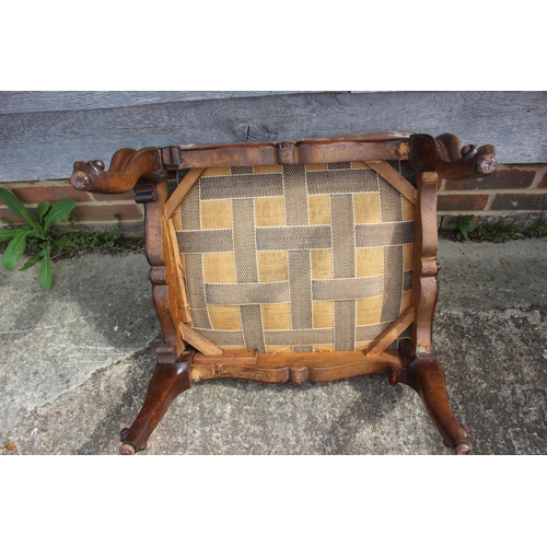 579 - A 19th century carved rosewood stool, upholstered in a floral cut velvet, on cabriole supports, 24