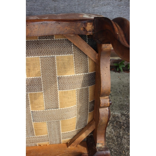 579 - A 19th century carved rosewood stool, upholstered in a floral cut velvet, on cabriole supports, 24