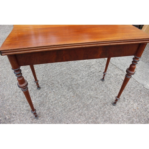 584 - A late 19th century Scandinavian fold-over top serpentine front tea table, on ebonised banded slende... 