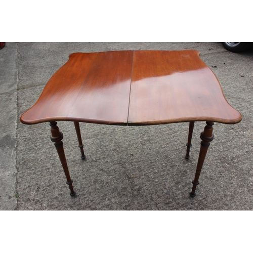 584 - A late 19th century Scandinavian fold-over top serpentine front tea table, on ebonised banded slende... 