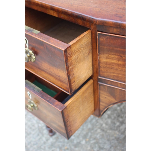 591 - A George III mahogany inverse breakfront sideboard/dressing table, fitted five drawers with brass li... 