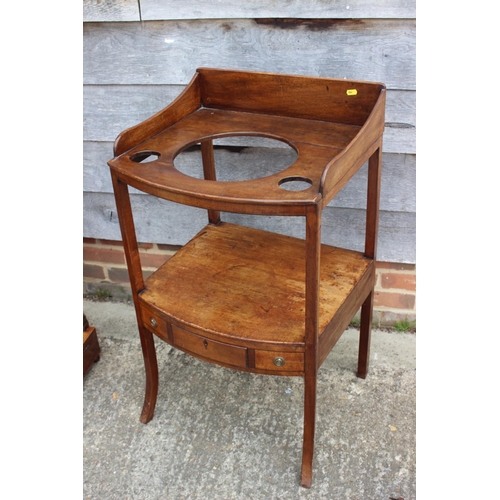 594 - A late Georgian mahogany bowfront washstand, fitted one drawer, on splay supports, 19