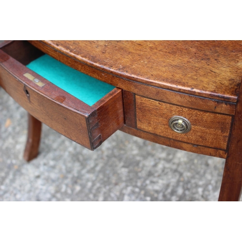 594 - A late Georgian mahogany bowfront washstand, fitted one drawer, on splay supports, 19