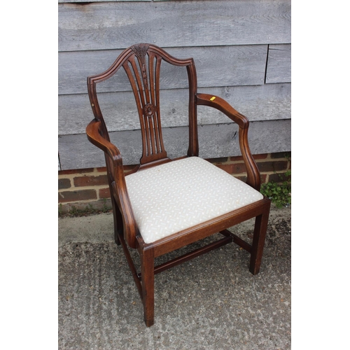 595 - A late Georgian Sheraton design mahogany elbow chair with drop-in seat, on square taper supports