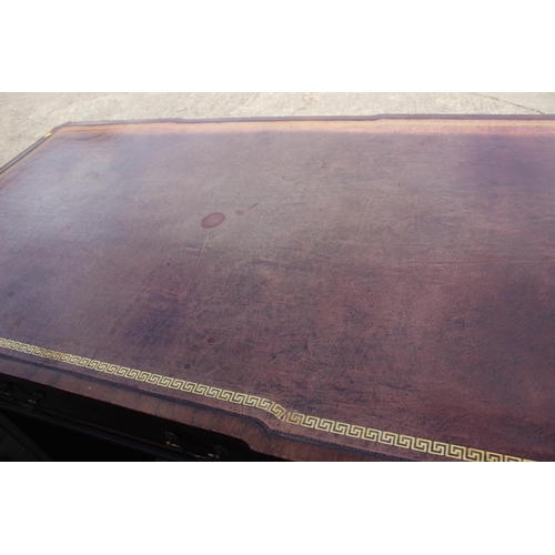 596 - A partners early 20th century mahogany double pedestal desk with tooled lined leather top, inverse b... 