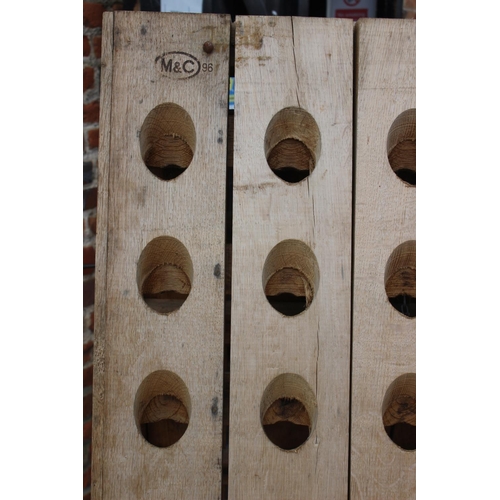 731 - A French oak planked riddling rack champagne bottle holder, 30 1/4