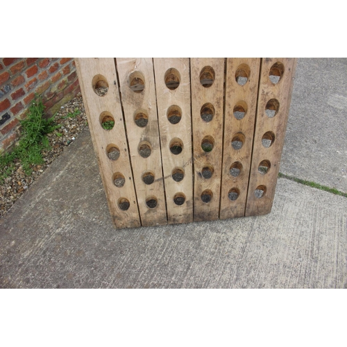 731 - A French oak planked riddling rack champagne bottle holder, 30 1/4