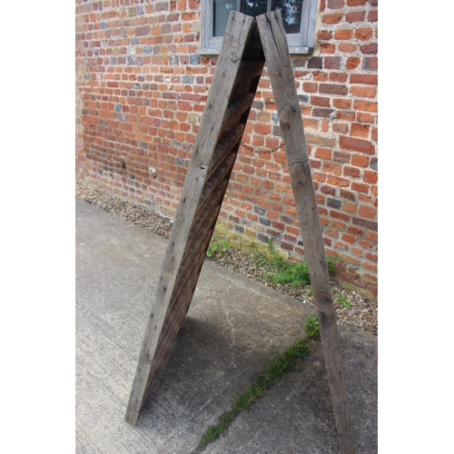 731 - A French oak planked riddling rack champagne bottle holder, 30 1/4