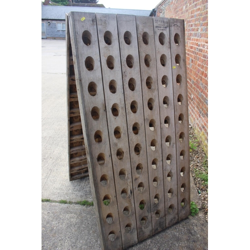 731 - A French oak planked riddling rack champagne bottle holder, 30 1/4