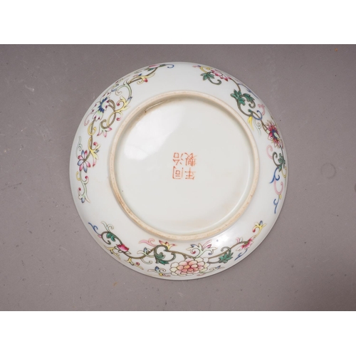 104 - A Chinese dish decorated character and butterflies and reverse decorated with flowers, four-characte... 