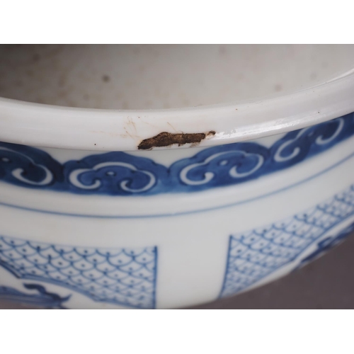 109 - A Chinese blue and white jardiniere with panelled precious object decoration, 8 3/4