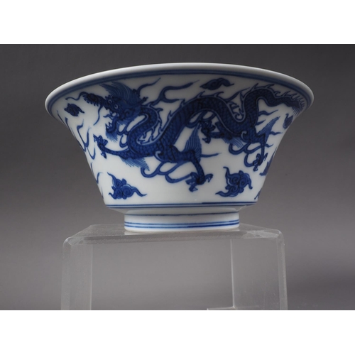 117 - A Chinese blue and white bowl with exterior dragon, cloud and flaming pearl decoration, and interior... 