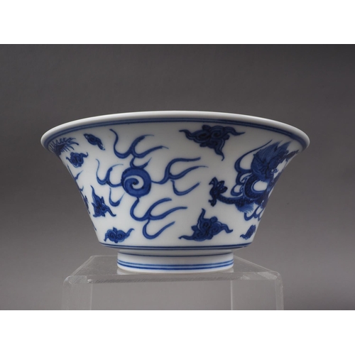 117 - A Chinese blue and white bowl with exterior dragon, cloud and flaming pearl decoration, and interior... 