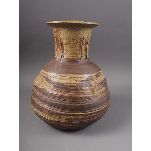 12 - A St Ives studio pottery bulbous vase with incised decoration, 10 1/4