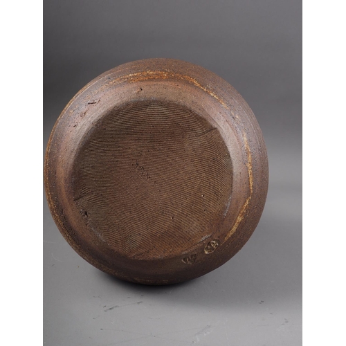 12 - A St Ives studio pottery bulbous vase with incised decoration, 10 1/4