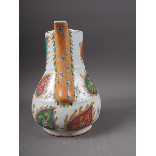 14 - A Turkish Kutahya jug of traditional design, 8