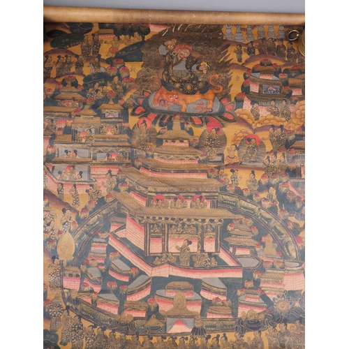 141 - A Tibetan? silk and painted silk scroll with Thangka design, 23 3/4