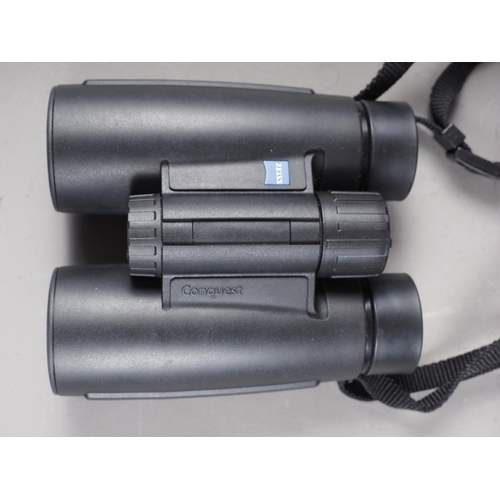 144 - A pair of Carl Zeiss 8 x 30 Conquest binoculars, in travelling case