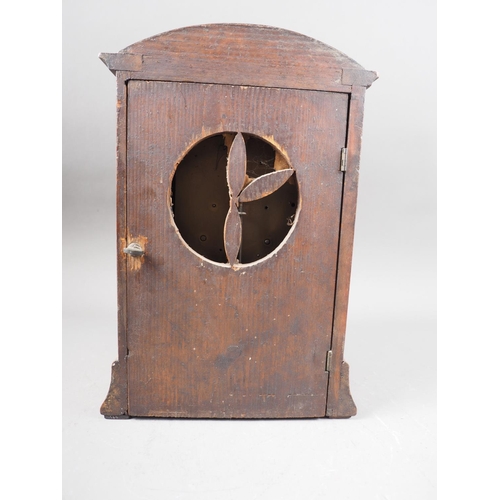 150 - An early 20th century mahogany and inlaid arch topped mantel clock with enamelled dial and Roman num... 