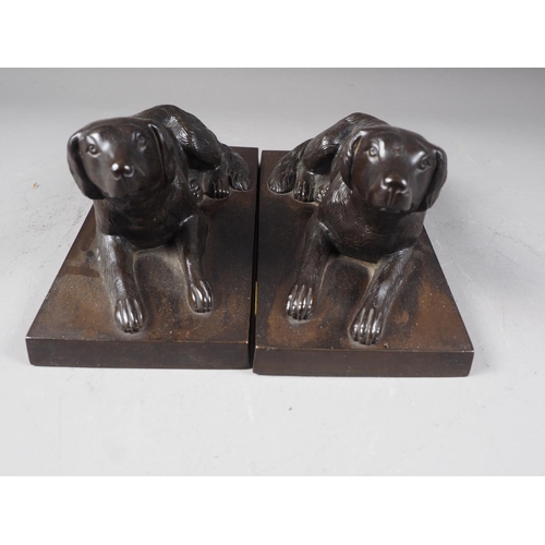 162 - A pair of bronze model reclining gun dogs, on rectangular bases, 8