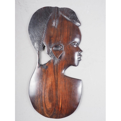 179 - An African carved ebony bust, a similar shallow relief bust, and a jar and cover, formed as a figure... 