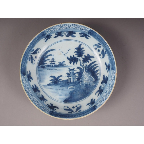 2 - A Delft blue and white dish with landscape decoration, 10 1/2