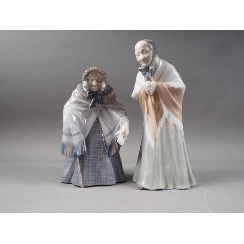 21 - Two Royal Copenhagen figures, an old woman (784), and a woman with prayer book (892)