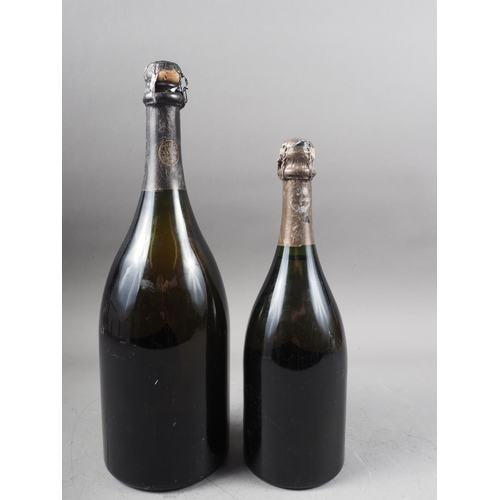 233 - A Magnum bottle of Cuvée Don Perignon champagne, vintage 1980, and another regular sized bottle, vin... 