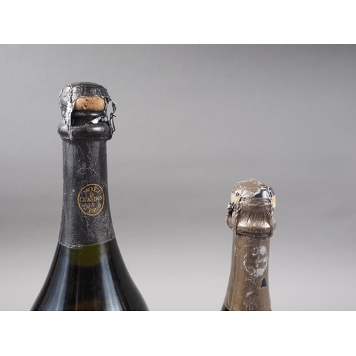 233 - A Magnum bottle of Cuvée Don Perignon champagne, vintage 1980, and another regular sized bottle, vin... 