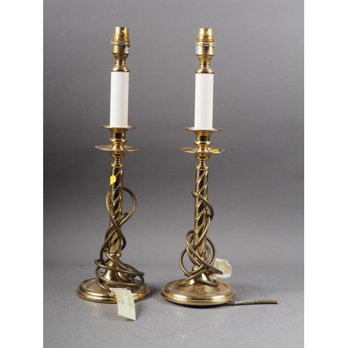 254 - A pair of brass table lamps with turned columns, on circular stepped bases, 17 1/2