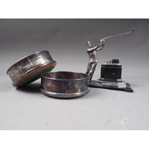 271 - A pair of silver plated wine bottle coasters and a table lighter with stand, mounted golfer, 6 3/4