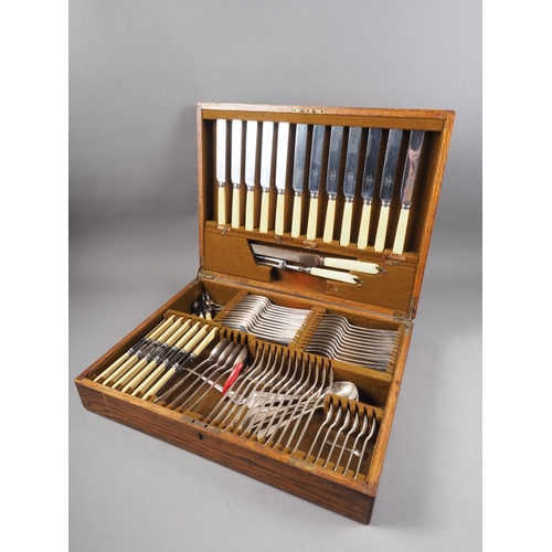 274 - An oak canteen of Mappin & Webb silver plated cutlery