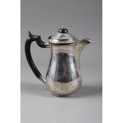 328 - A silver hot water pot with ebonised handle and knob, 7