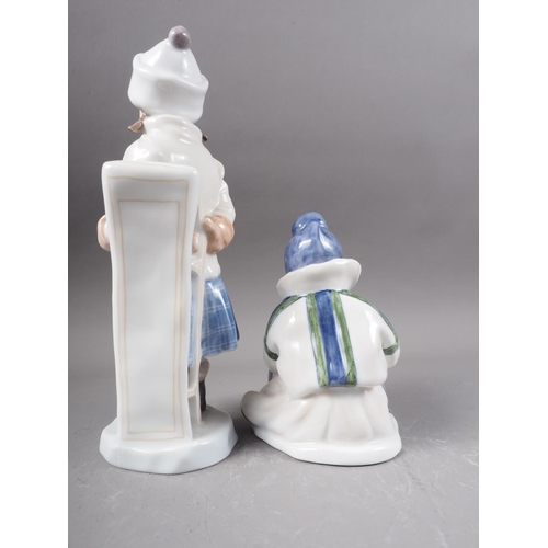 33 - Two Royal Copenhagen figures, girl with sled (1382) and Greenland girl (1398)