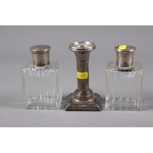 353 - A pair of cut glass and silver topped scent bottles and stoppers, 4 1/4